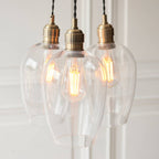Novena Tarn 3 Light Cluster Pendant in Antique Brass with Clear Glass Shades