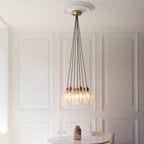 Novena Tarn 7 Light Cluster Pendant in Antique Brass with Clear Glass Shades