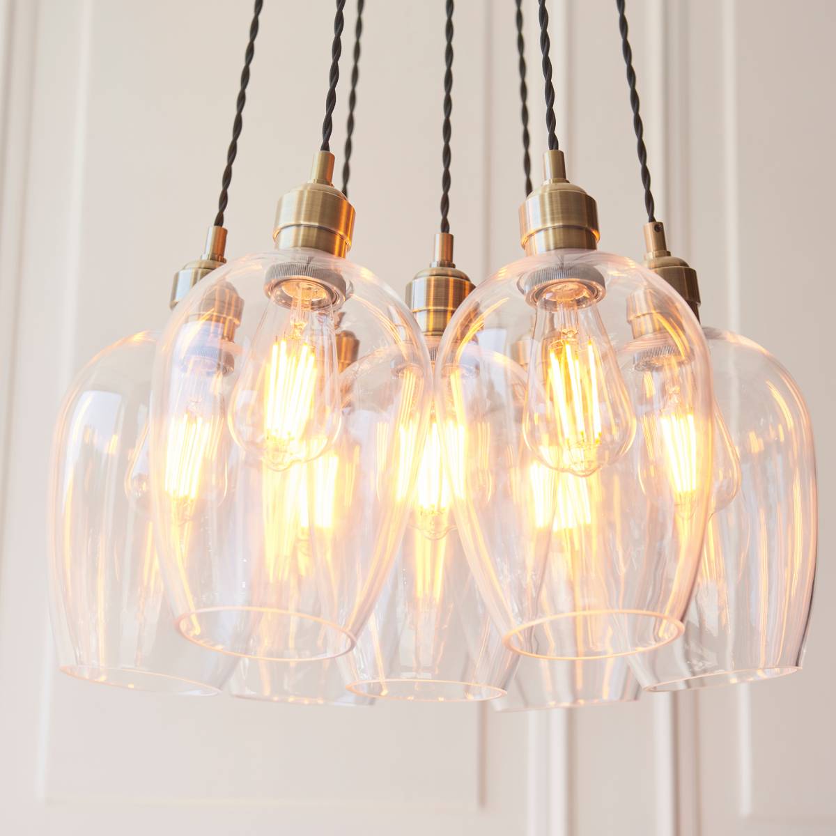 Novena Tarn 7 Light Cluster Pendant in Antique Brass with Clear Glass Shades