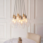 Novena Tarn 7 Light Cluster Pendant in Antique Brass with Clear Glass Shades
