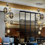 Schuller Ovila 9 Light Pendant Light in Chrome with Cognac and Smoky Grey Shade