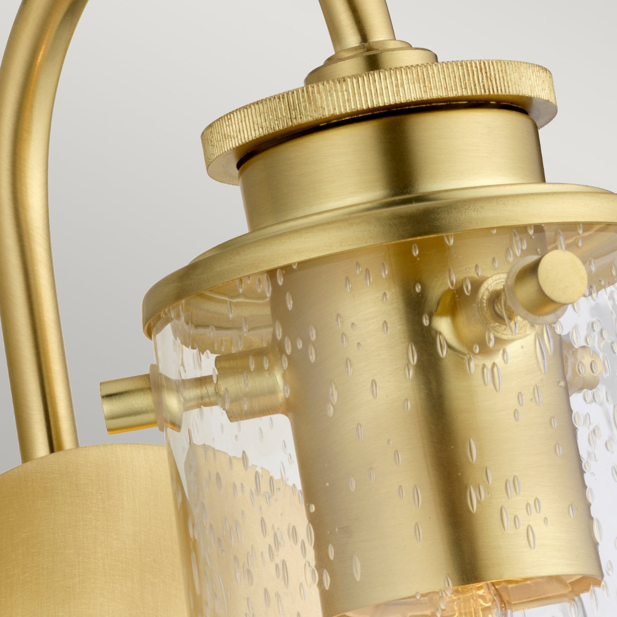 Quintiesse Braelyn 1 Light Wall Light Brushed Brass Clear Seedy Glass
